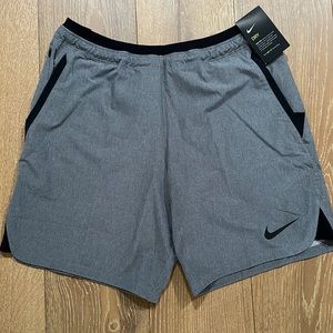 Brand new with tags, gray Nike Pro Dri-FIT training shorts.  Large, slim fit